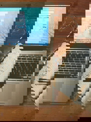 Laptop and notepad on desk