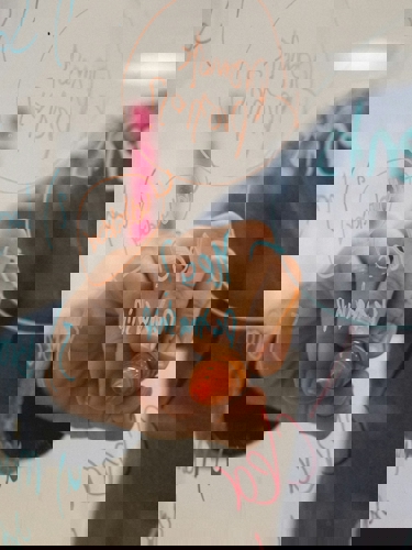 hand writing on see throuh whiteboard