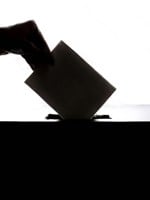 hand putting vote in box